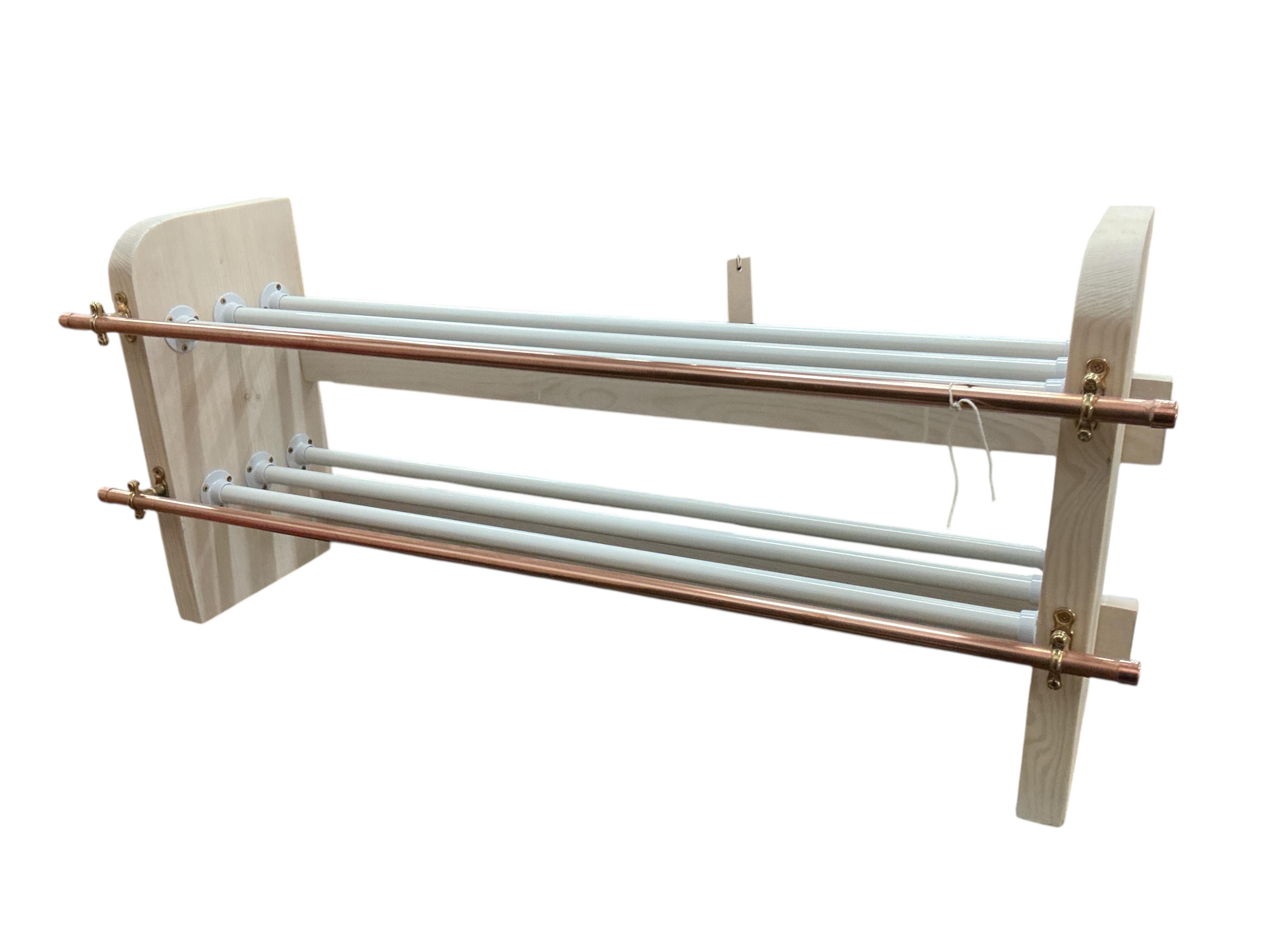 An industrial style painted wood and tubular copper shoe rack, width 93cm, depth 26cm, height 41cm